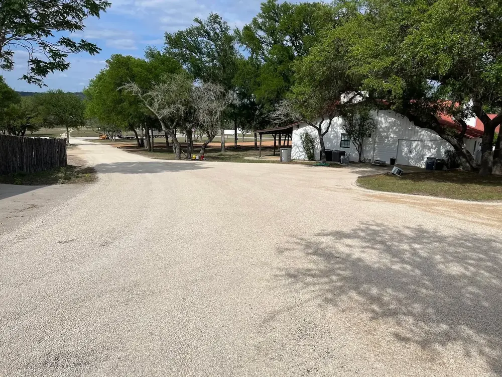 Freshly chip sealed driveway and parking area at a rural property
